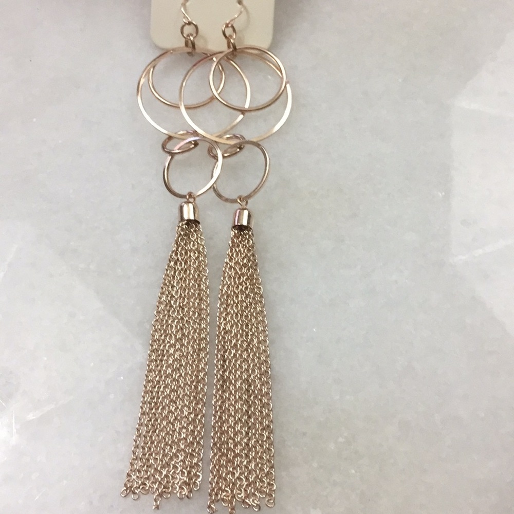 Long gold statement earrings gorgeous!